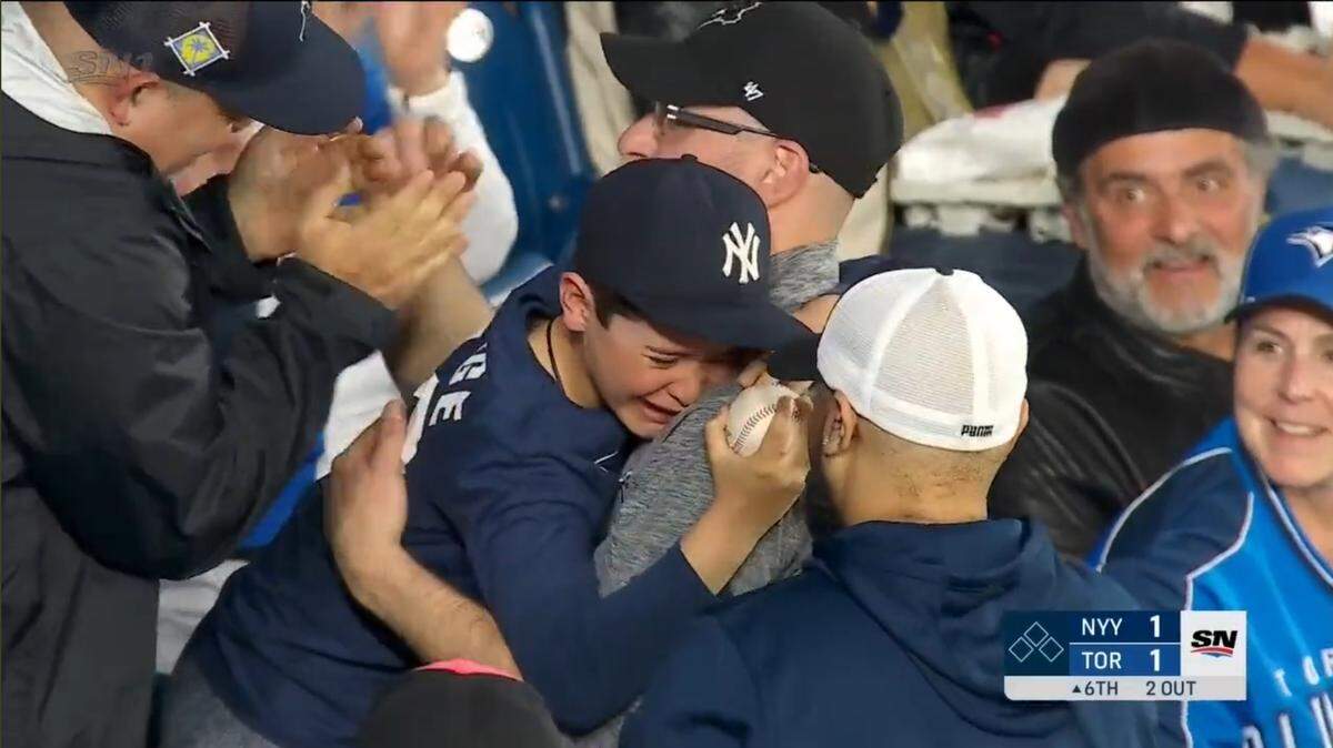 SportsNet in Canada showed a Toronto Blue Jays fan handing an Aaron Judge home run ball to a young New York Yankees fan at Rogers Centre Tuesday. The video went viral.
