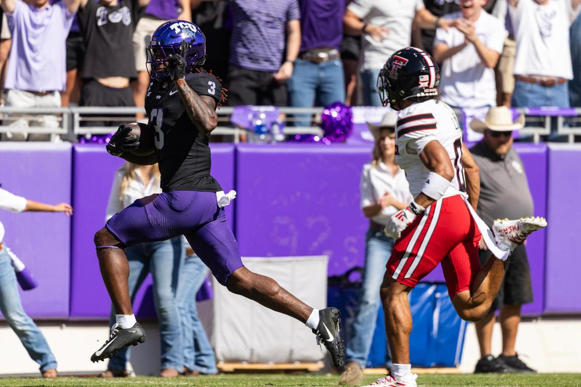TCU wide receiver Savion Williams (3) holds up the peace sign to Texas Tech defensive back Bralyn Lux (0) on the way to a touchdown in the first half of an NCAA football game between TCU and Texas Tech at Amon G. Carter Stadium in Fort Worth on Saturday, Oct. 26, 2024.
