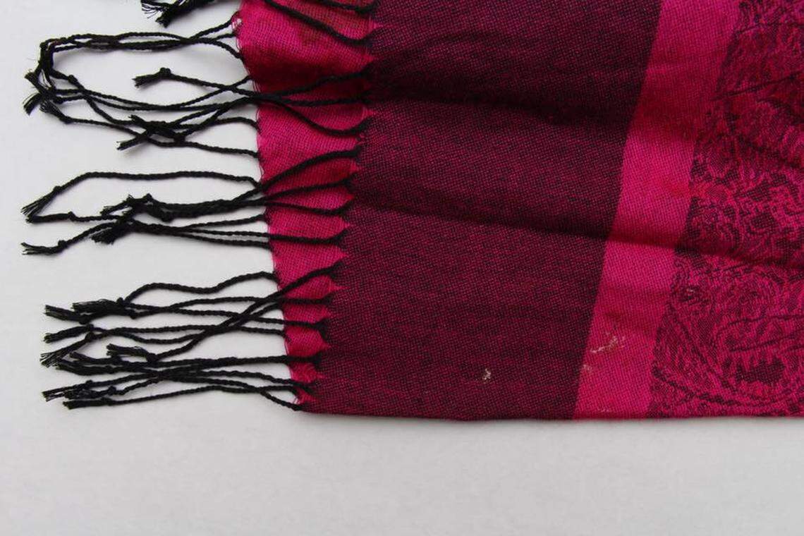 Arlington police on Tuesday released this image of a pink scarf that was found next to a newborn baby boy in a suitcase on Saturday morning. The boy is recovering, police said, and the department is looking for the identity of the mother.