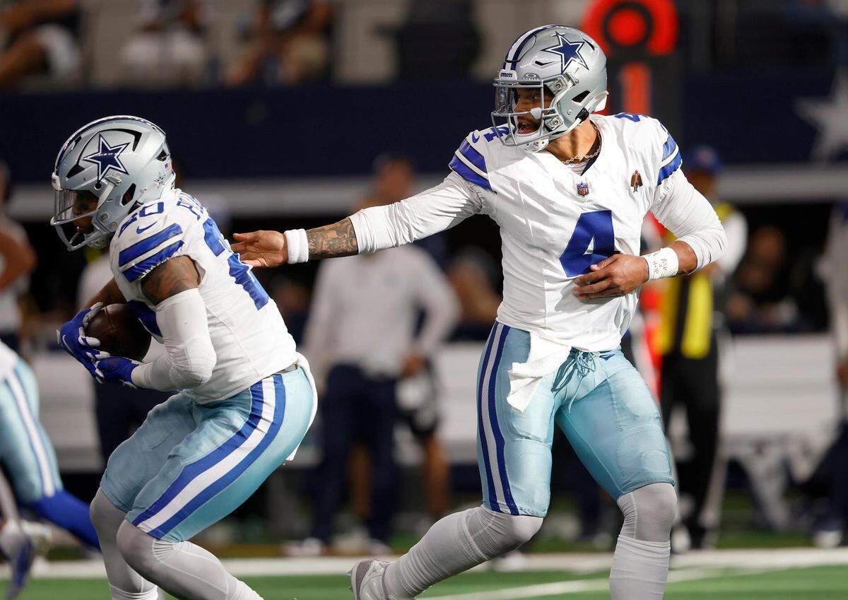 Dallas Cowboys quarterback Dak Prescott hands the ball to running back Tony Pollard during the second half against the New York Jets on Sunday, September 17, 2023, at AT&T Stadium in Arlington.