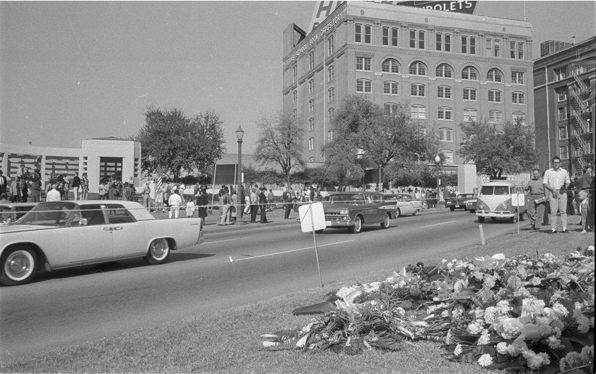 Nov. 23, 1963: Dealey Plaza and the Texas State Book Depository building with crowds on street mourning the assassination of President John F. Kennedy the day after the shooting.