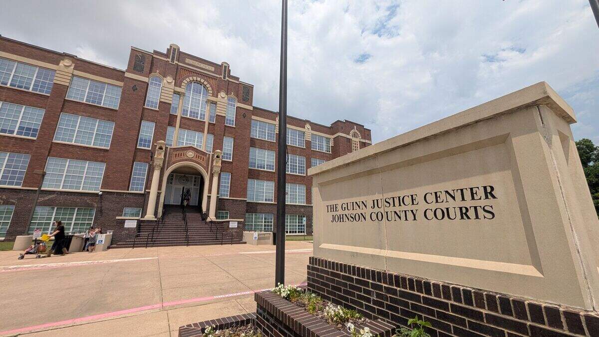 A wide shot of a courthouse building located in a converted high school