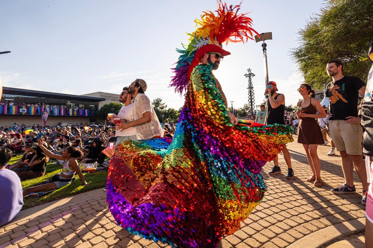 Brent Gibert shows off his outfit at the Arlington Pride event at Levitt Pavilion in Arlington on Saturday, June 8, 2024.