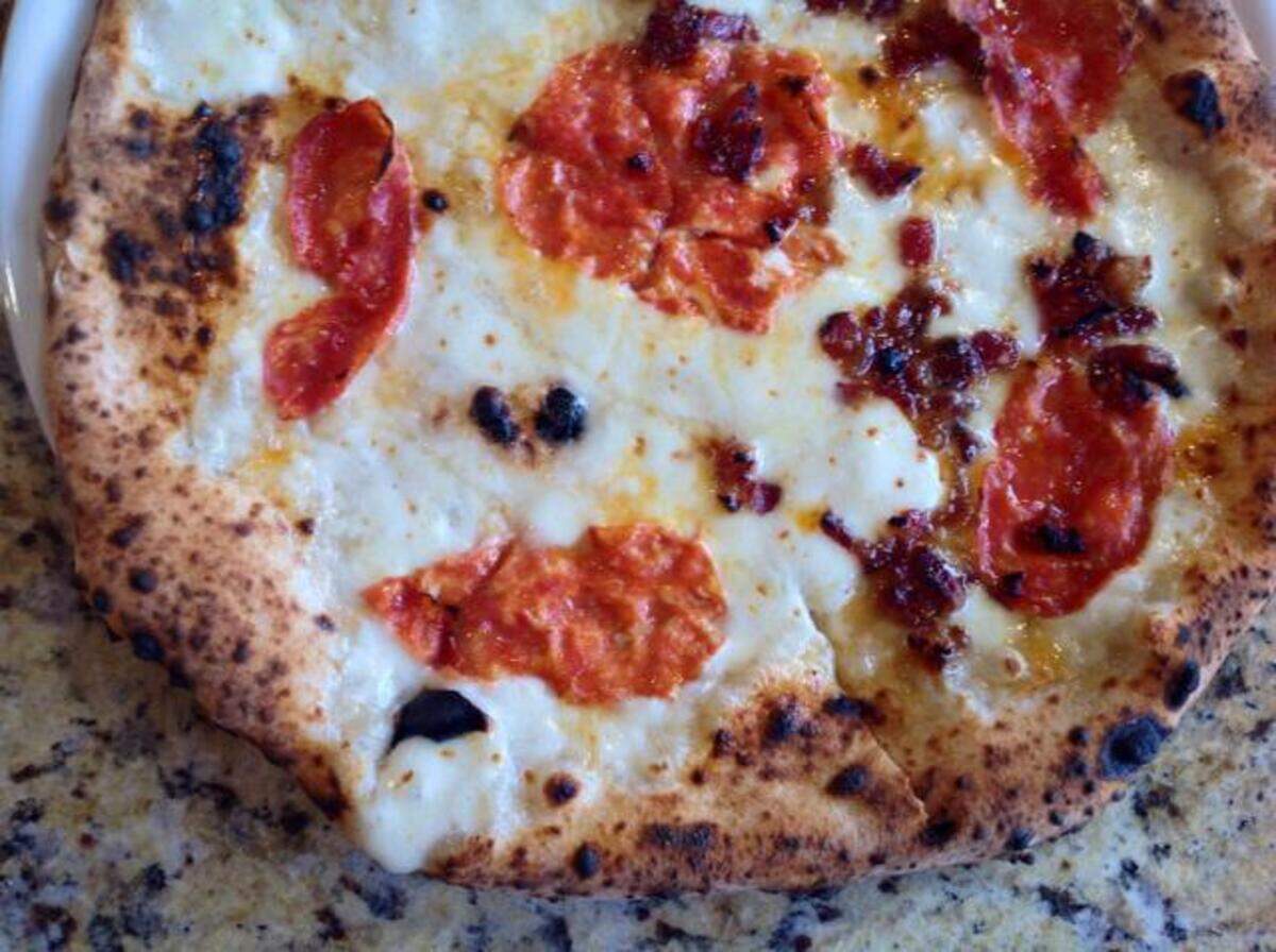 Cane Rosso’s Honey Badger pizza (off-menu) is drizzed with light honey for a spicy-sweet combination.