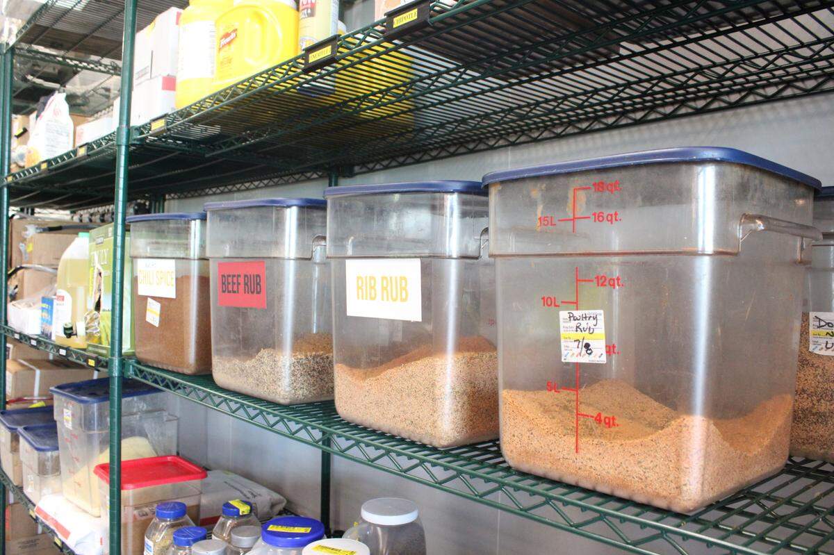 Just to the right of the register is Loop 9’s shelves filled with homemade barbecue rubs and sauces. You can see how different each rub is, like the brisket’s being grained with pepper.