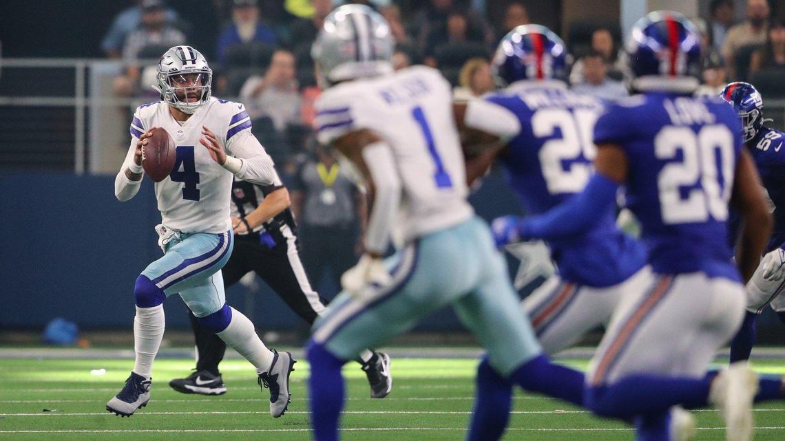 Dallas Cowboys quarterback Dak Prescott scrambles in the fourth quarter while looking for an open player to throw to Sunday, 364 days after sustaining a season-ending ankle injury to the same New York Giants on the same AT&T Stadium field.