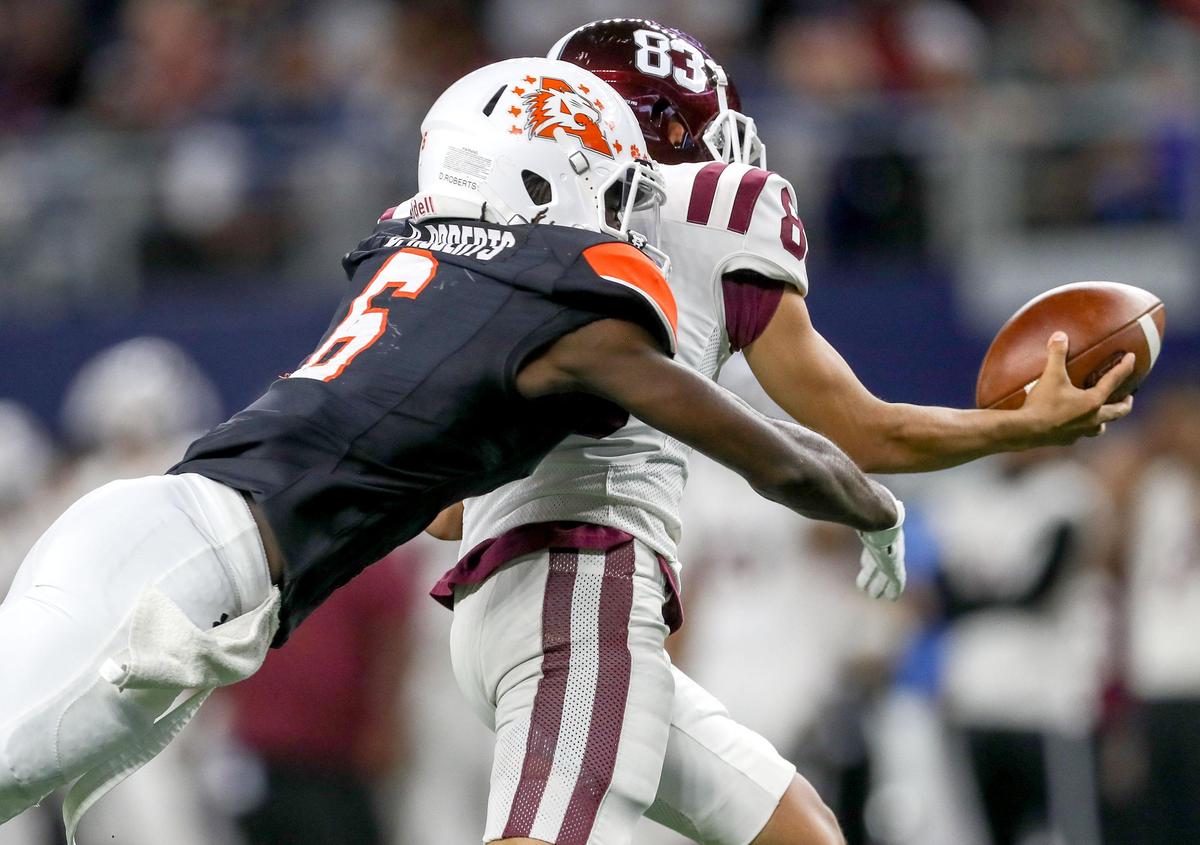 Aledo’s Demarco Roberts (6) tackles Red Oak punter Dakota Santos (83) as he funbles the ball during the first half of their 5A Division II Regional Round High School Football playoff game at AT&T Stadium in Arlington, Tx Friday November 29, 2019.