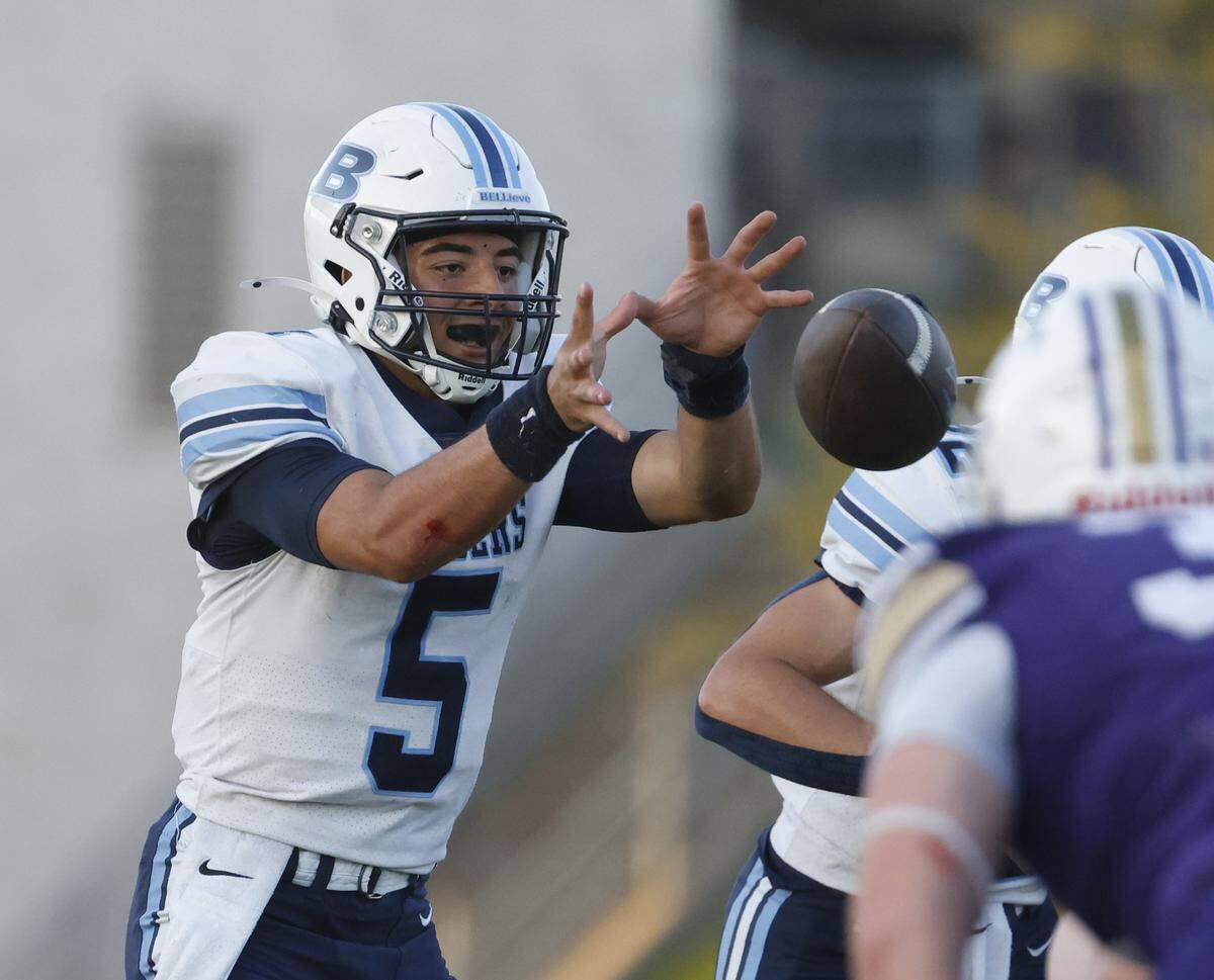 L.D. Bell quarterback Braylon Harris (5) takes the snap during the first half of a UIL football game between L.D. Bell and Timber Creek at Keller ISD Athletic Complex in Keller on Thursday, Sept. 11, 2025.