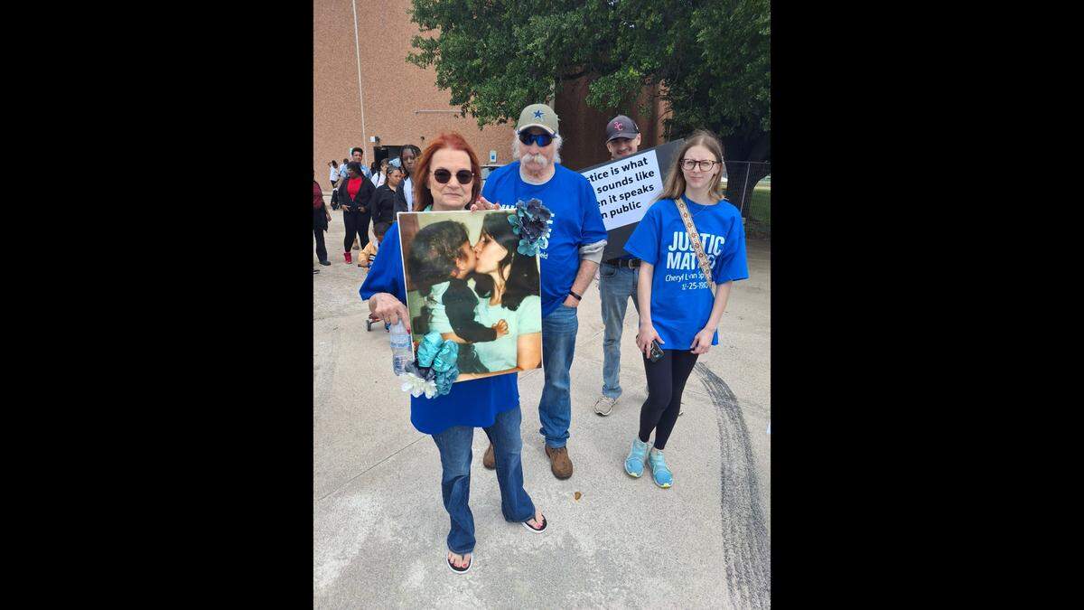 Jan Webster holds a photo of her younger sister, Cheryl Lynn Springfield, during Thaw The Cold Cases’ third annual awareness walk in downtown Fort Worth on April 19. Springfield’s 1980 Christmas Day murder has never been solved.