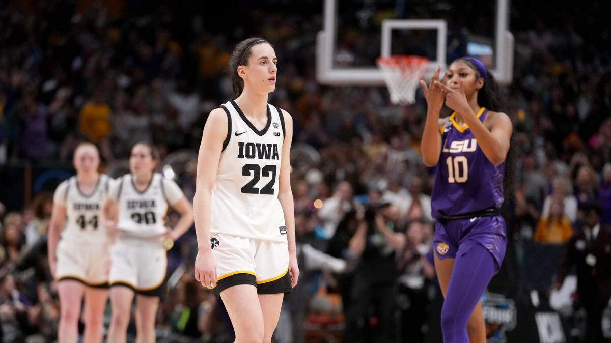 LSU forward Angel Reese (10) shows Iowa guard Caitlin Clark (22) her ring finger during final seconds of the NCAA Women’s National Championship basketball game in Dallas, Sunday, April 2, 2023.
