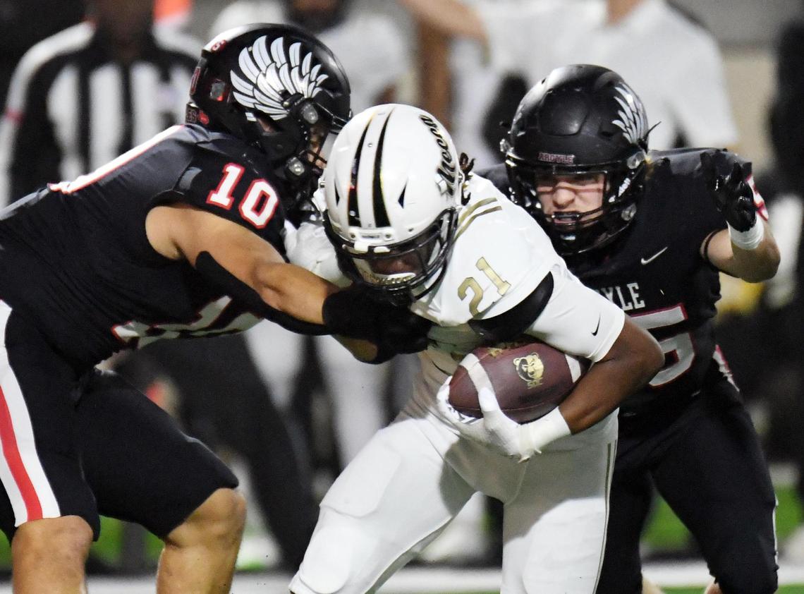 Argyle’s Grant Mirabal, left and Bud Petter tackle South Oak Cliff’s Danny Green for a loss as he tries to rush out of the backfield in the first quarter of Friday’s December9, 2022 5A Division 2 State Semifinals playoff football game at the Crowley ISD Multi-Purpose Stadium in Fort Worth, Texas. Special/Bob Haynes