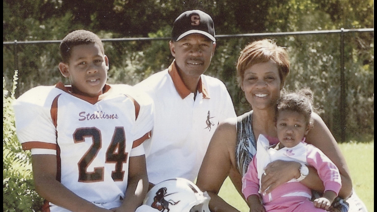 Ross Blacklock (left) with his family, including his father, Harlem Globetrotters coach Jimmy Blacklock.