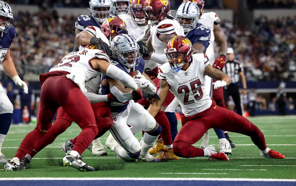 Dallas Cowboys running back Rico Dowdle pushes towards the end zone during the second quarter against the Washington Commanders on Sunday, Jan. 5, 2025, at AT&T Stadium.