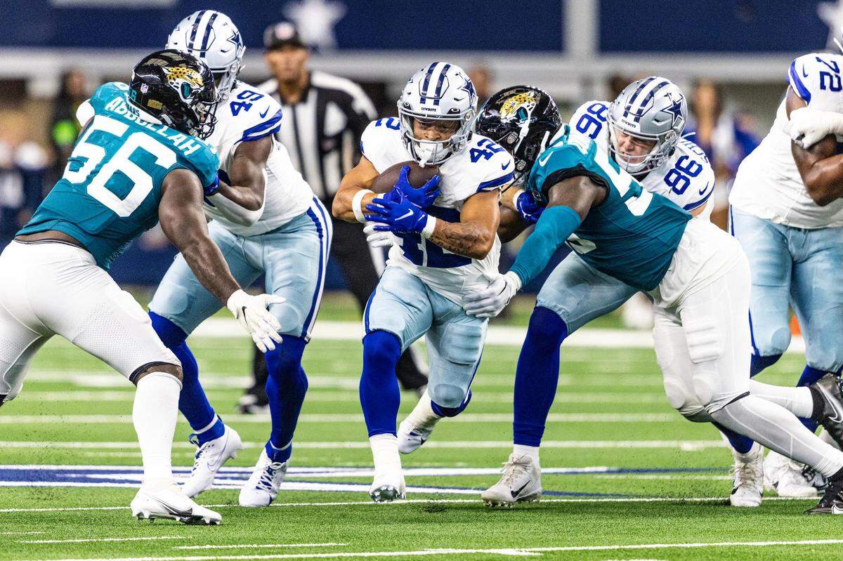 Dallas Cowboys running back Deuce Vaughn (42) finds the hole and rushes up field for a big gain in the third quarter during the first preseason game between the Dallas Cowboys and Jacksonville Jaguars at AT&T Stadium in Arlington, Texas on Saturday, Aug. 12, 2023.