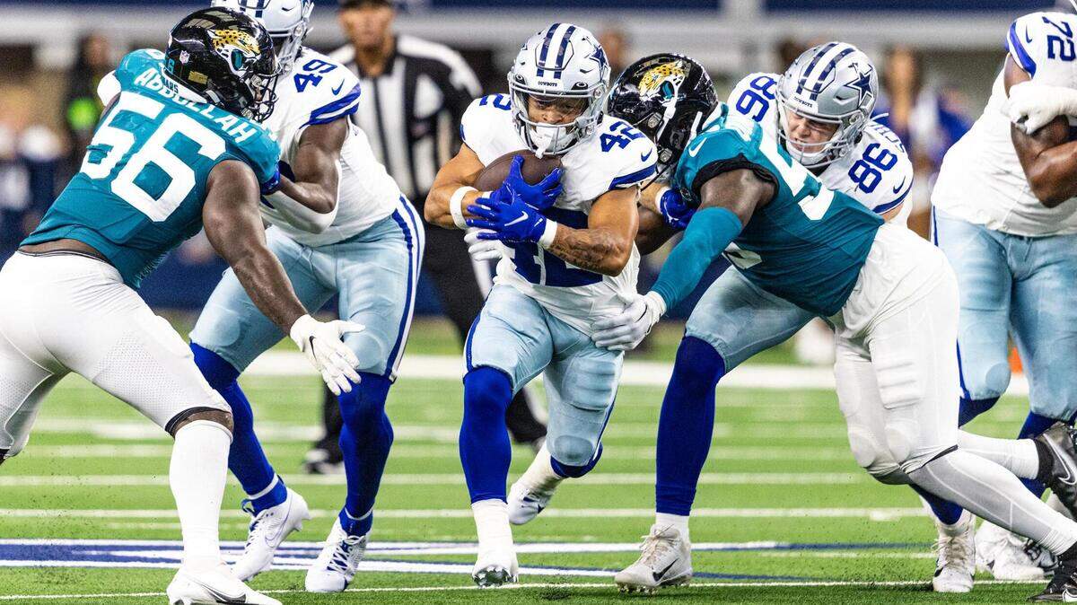 Dallas Cowboys running back Deuce Vaughn (42) finds the hole and rushes up field for a big gain in the third quarter during the first preseason game between the Dallas Cowboys and Jacksonville Jaguars at AT&T Stadium in Arlington, Texas on Saturday, Aug. 12, 2023.