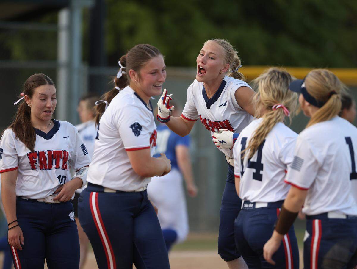 Grapevine Faith center fielder Michaela Hamilton celebrates with team mates after winning a softball game at Oak Grove Park in Grapevine, Tx. Tuesday, March 31, 2026