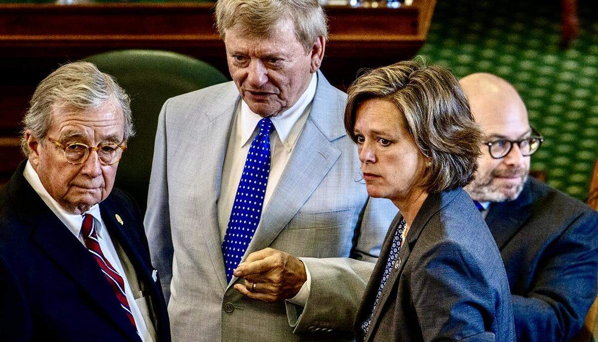 Texas House lawyer Rusty Hardin speaks with state Rep. Ann Johnson, right, and other advisors and prosecutors ahead of Texas Attorney General Ken Paxton’s impeachment trial on Sept. 6, 2023 in Austin, Texas.