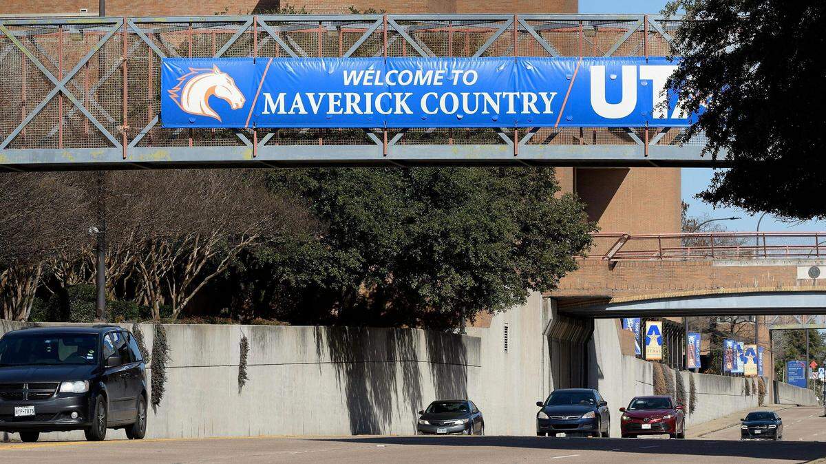 Cars travel on Cooper Street through the heart of the UTA's where enrollment is up 28 percent over 5 years ago.
