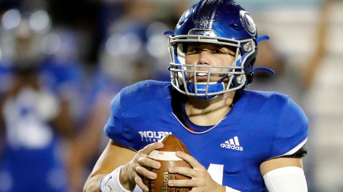 Nolan Catholic quarterback Jimmy Taylor (14) and the Vikings play host to Dallas Parish Episcopal on Friday. (Special to the Star-Telegram Bob Booth)