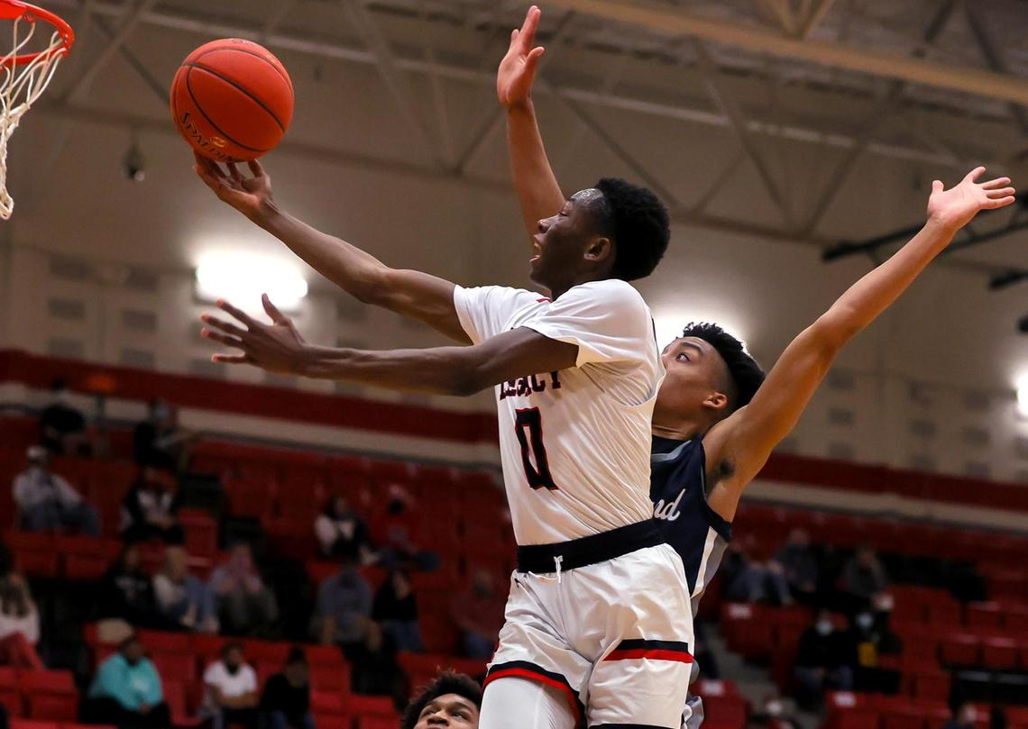 Mansfield Legacy guard Wayne Wiggins (0) goes to the basket for two points against Richland guard Jourdyn Grandberry during the first half of a 5A Region 1 Boys Basketball Area-Round 2 playoff game played on February 24, 2021 at Burleson High School. (Steve Nurenberg Special to the Star-Telegram)