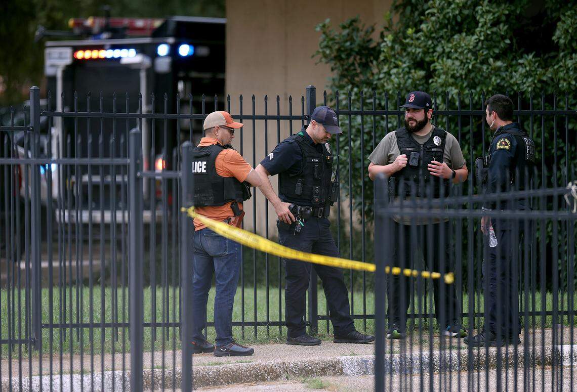 FBI agents investigate the scene where a shooting at an Immigration and Customs Enforcement facility occurred in Dallas on Wednesday, Sept. 24, 2025.