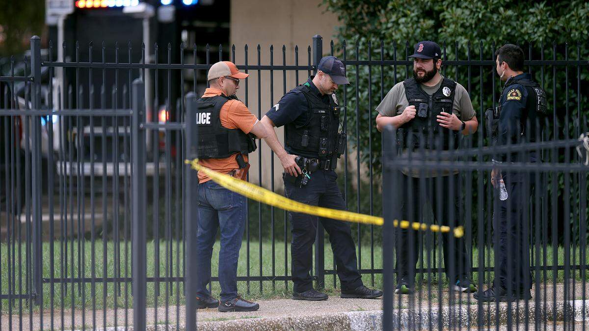 FBI agents investigate the scene where a shooting at an Immigration and Customs Enforcement facility occurred in Dallas on Wednesday, Sept. 24, 2025.