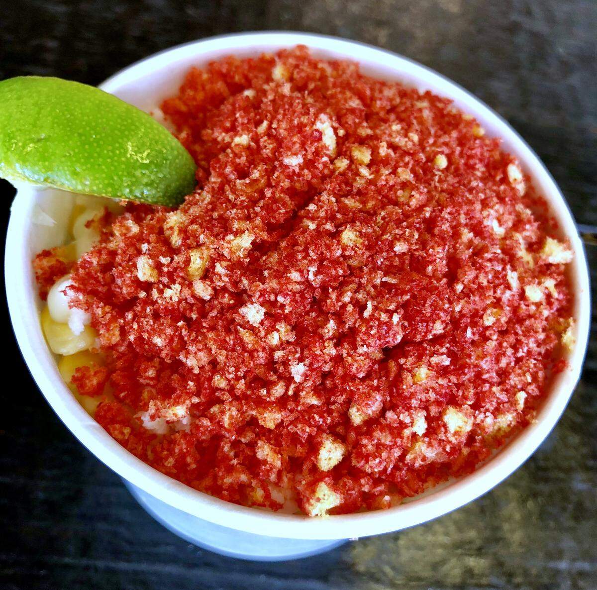 OMG elotes (corn) are topped with Cheetos Crunchy Flamin’ Hot