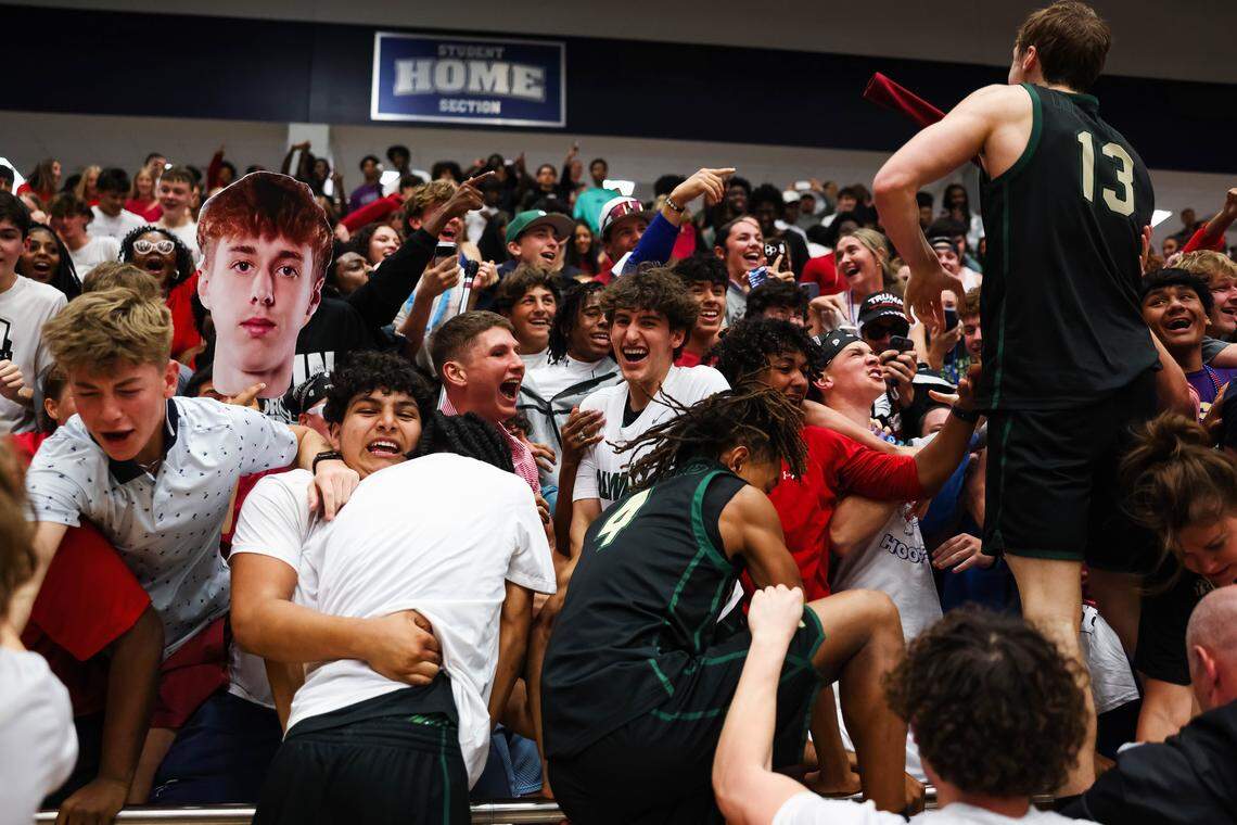 Birdville players jump and celebrate in the stands with fellow students after clinching a spot in the state semifinals after a 50-49 UIL Class 5A Division I regional final win against Denton at Flower Mound High School in Flower Mound, Texas, Friday, March 6, 2026.