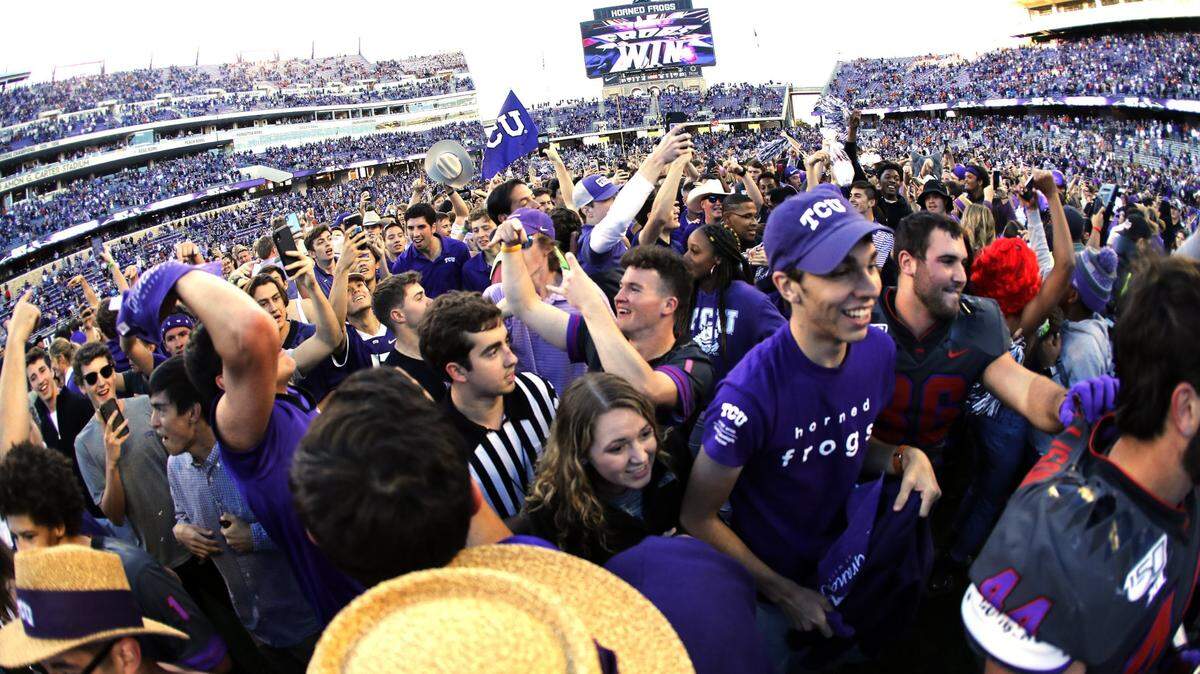 TCU fans stormed the field after the Horned Frogs defeated Texas in October 2019. TCU has won seven of nine games against Texas since they joined the Big 12.