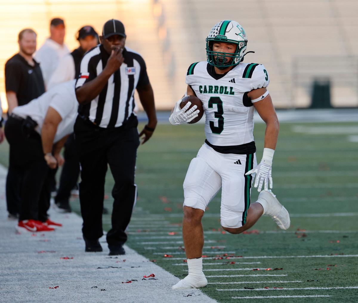 Southlake Carroll running back Davis Penn steps out of bounds after a short gain against Euless Trinity last season at Pennington Field in Bedford.