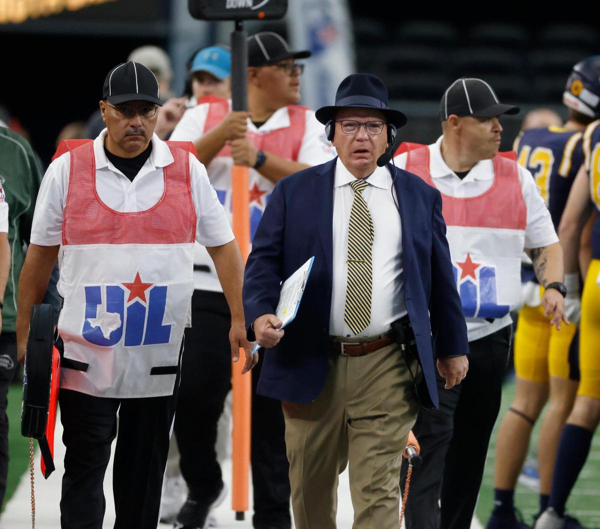 Highland Park head coach Randy Allen enters the field with the officialsduring the UIL 5A D1 State Championship football game at AT&T Stadium in Arlington, Texas, Saturday, Dec. 21, 2024.