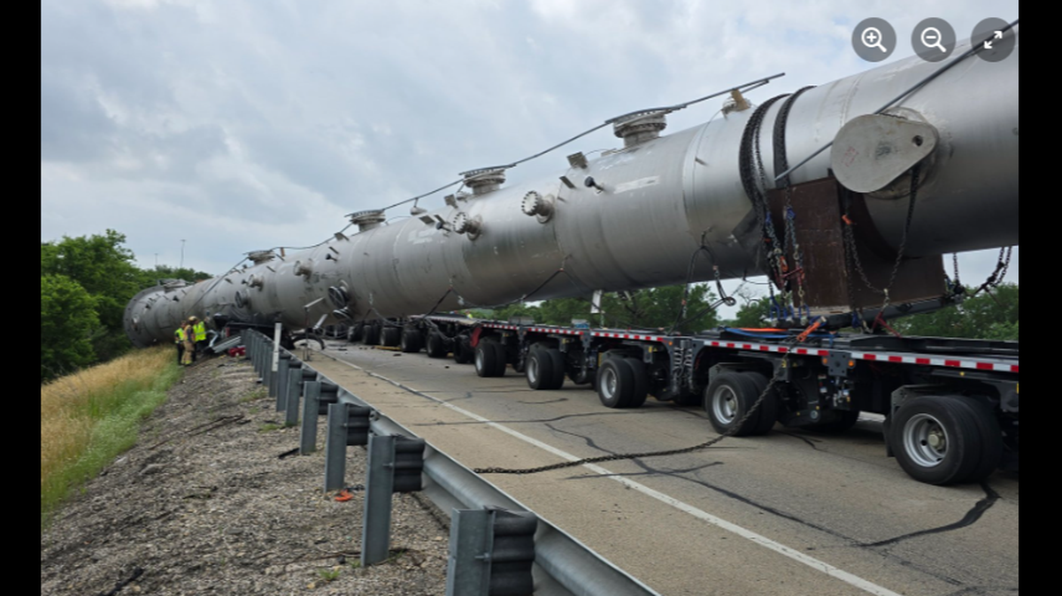 A 350,000-pound load came loose from a trailer and crushed a vehicle, killing two, Texas firefighters say.