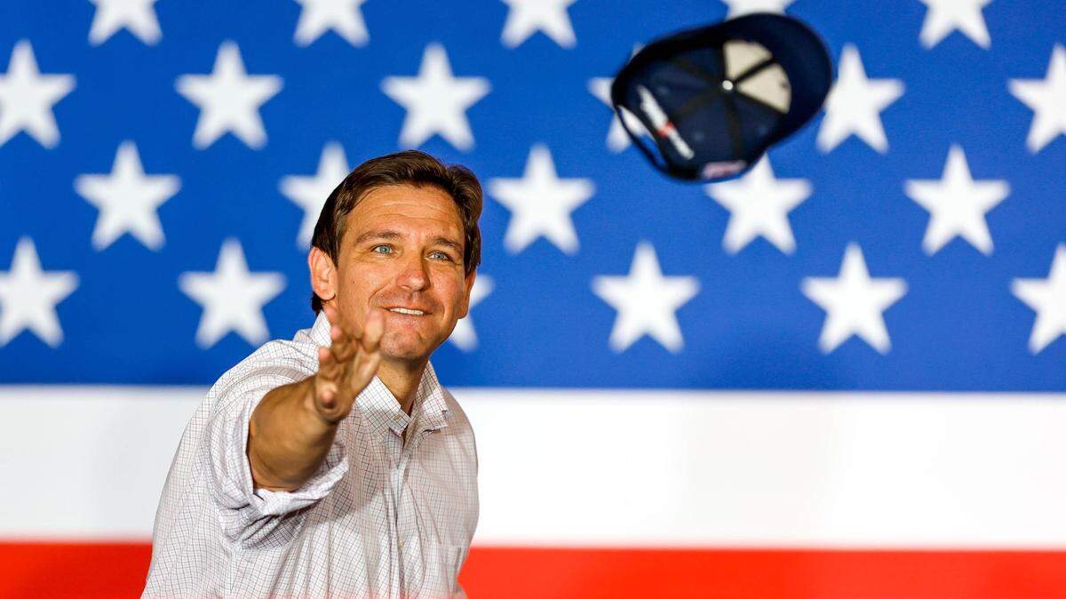 Florida Gov Ron DeSantis throws hats to the crowd at an event held by the Never Back Down PAC featuring presidential candidate DeSantis in Tulsa, Okla., on Saturday, June 10, 2023.