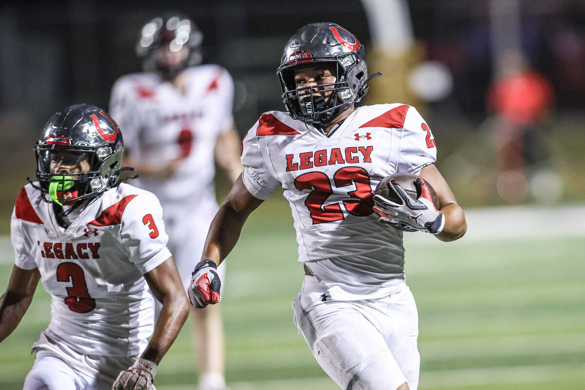 Mansfield Legacy running back J-Uan Harrison Jr. runs the ball against Mansfield in Friday’s game at Vernon Newsom Stadium. Special to the Star-Telegram / Tom Marvin