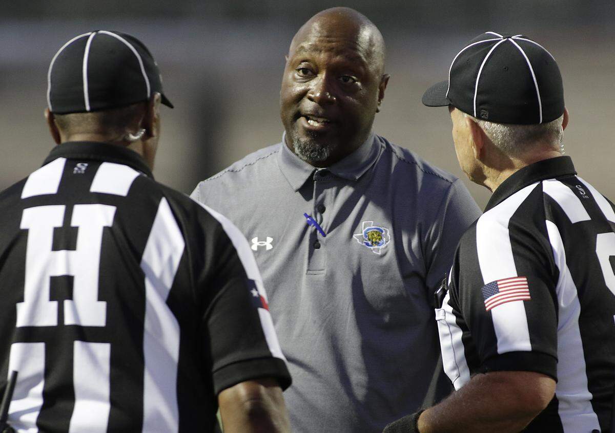 Summit head coach Channon Hall talks with referees  during their game at Newsom Stadium on Thursday, Sept. 25, 2025. 