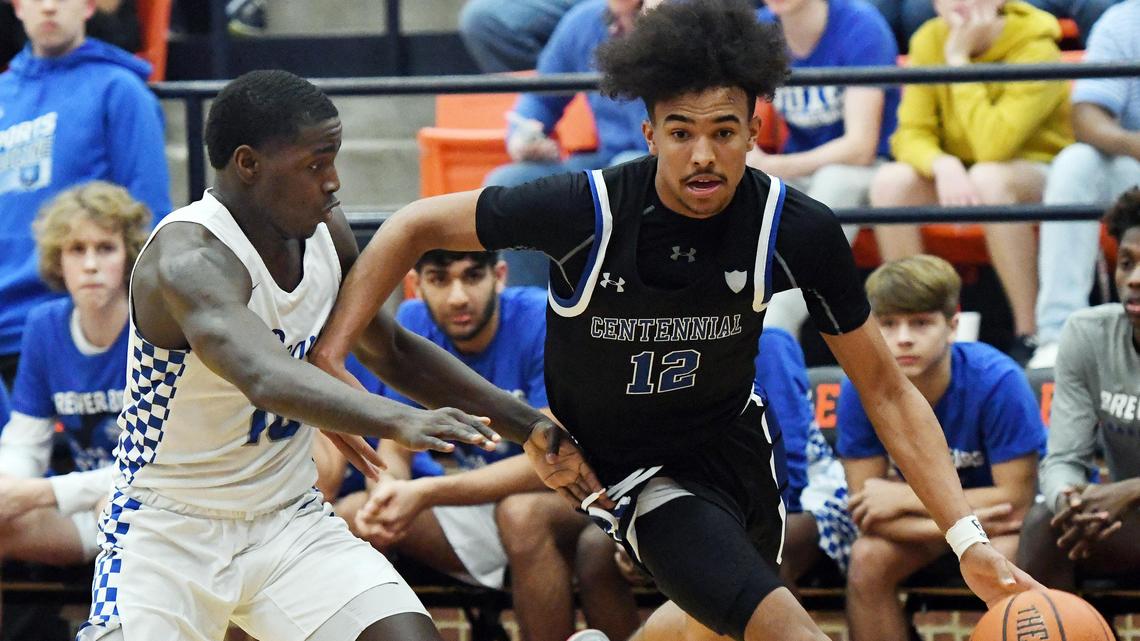Burleson Centennial’s Tayton Conerway, right, drives to the basket against Brewer’s Devin Avent in the second quarter of their 5A Area Championship basket ball game Friday, February 28, 2020 at Aledo High School in Aledo. Texas. Centennial went on to win 75-70. Special/Bob Haynes
