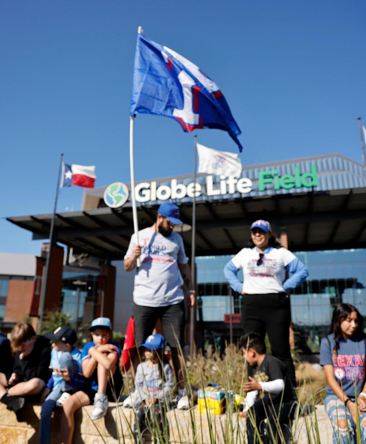Christian and Brenda Ruic show their support during the Texas Rangers World Series Parade in Arlington, Texas, Friday, Nov. 03, 2023. (Special to the Star-Telegram Bob Booth)