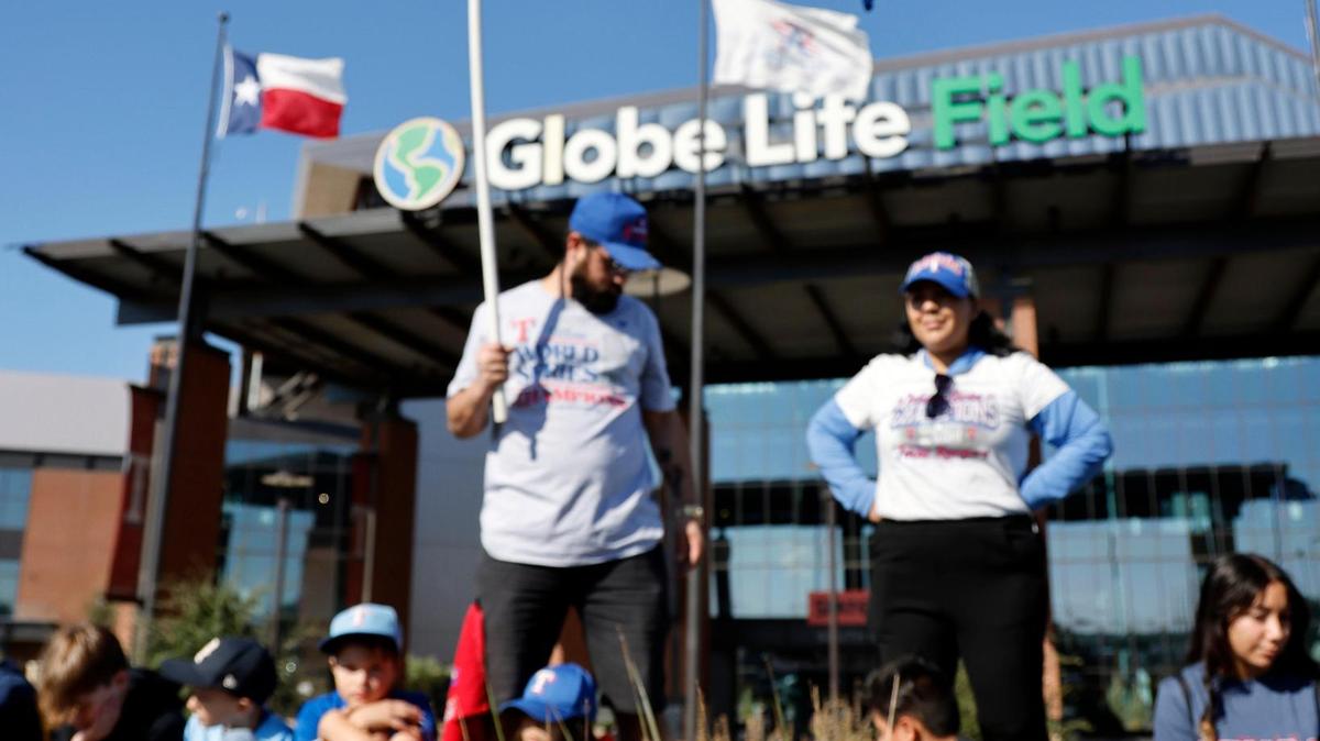 Christian and Brenda Ruic show their support during the Texas Rangers World Series Parade in Arlington, Texas, Friday, Nov. 03, 2023. (Special to the Star-Telegram Bob Booth)