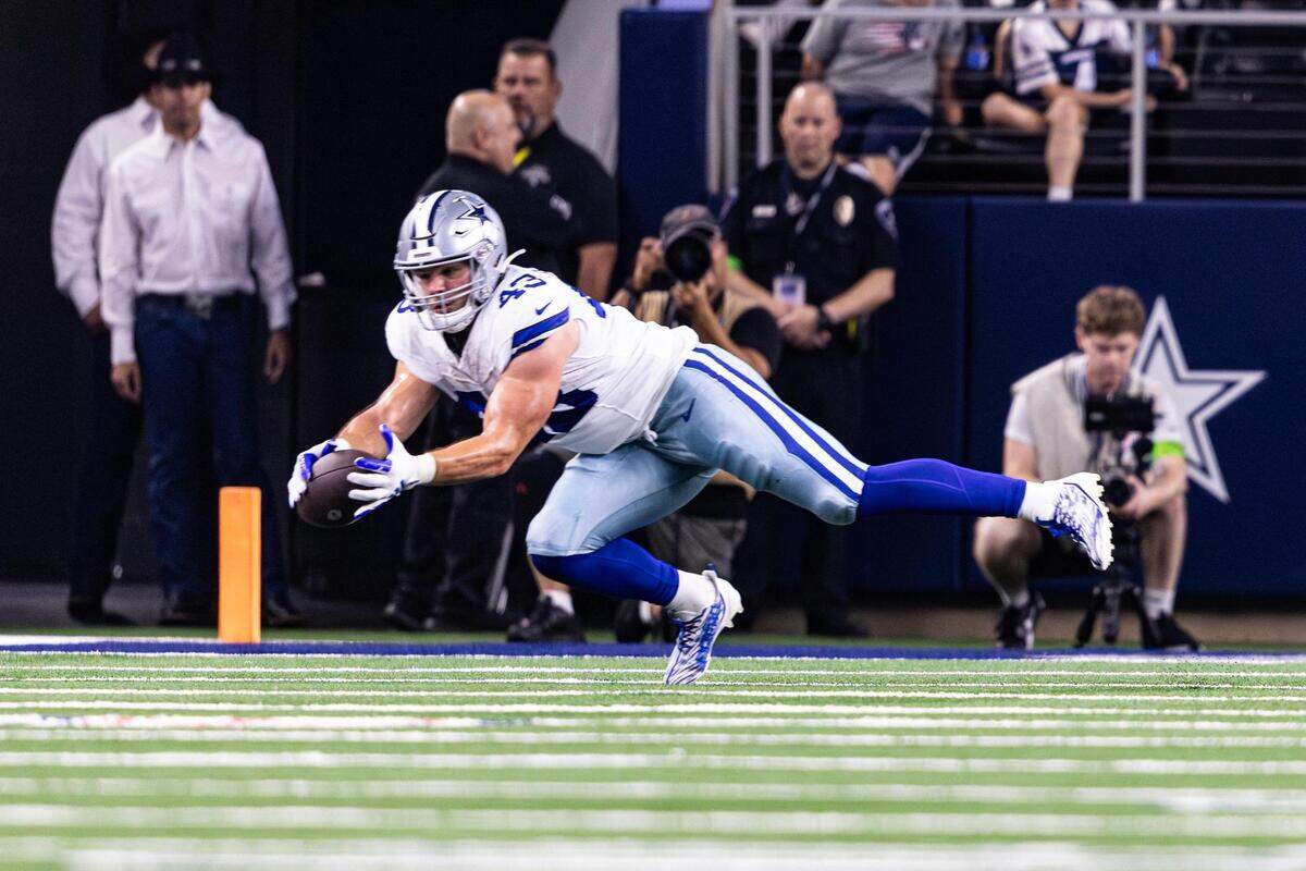 Dallas Cowboys running back Hunter Luepke (43) dives for a catch in the first half of a preseason game against the Las Vegas Raiders at AT&T Stadium in Arlington, Texas on Saturday, Aug. 26, 2023.