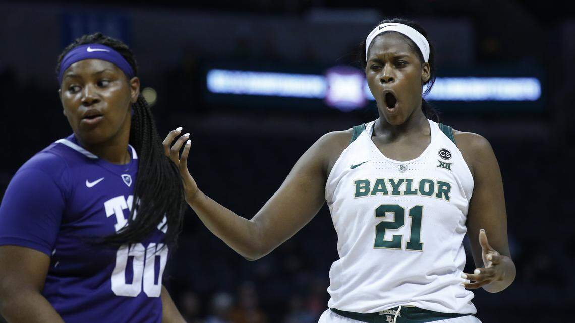 Baylor center Kalani Brown (21) reacts to a call in front of TCU forward Amy Okonkwo (00) in the first half of an NCAA college basketball game in the semifinals of the women's Big 12 conference tournament in Oklahoma City, Sunday, March 4, 2018.