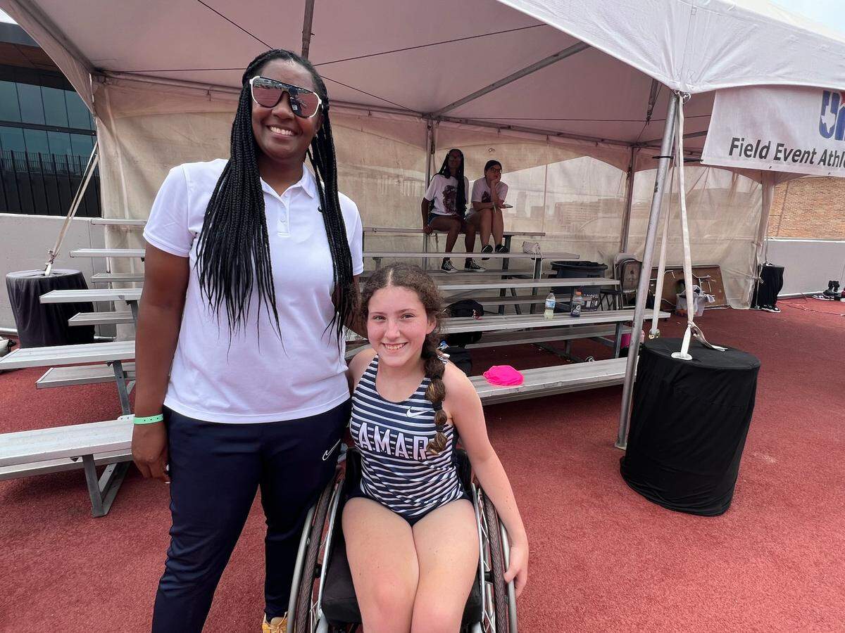 Arlington Lamar freshman Delia Bass and Lamar Track and Field coach Ronniqua Camp pose for a photo during the UIL Texas State Track and Field Meet at Mike A. Myers Stadium in Austin, Texas, on Friday, May 2, 2025.