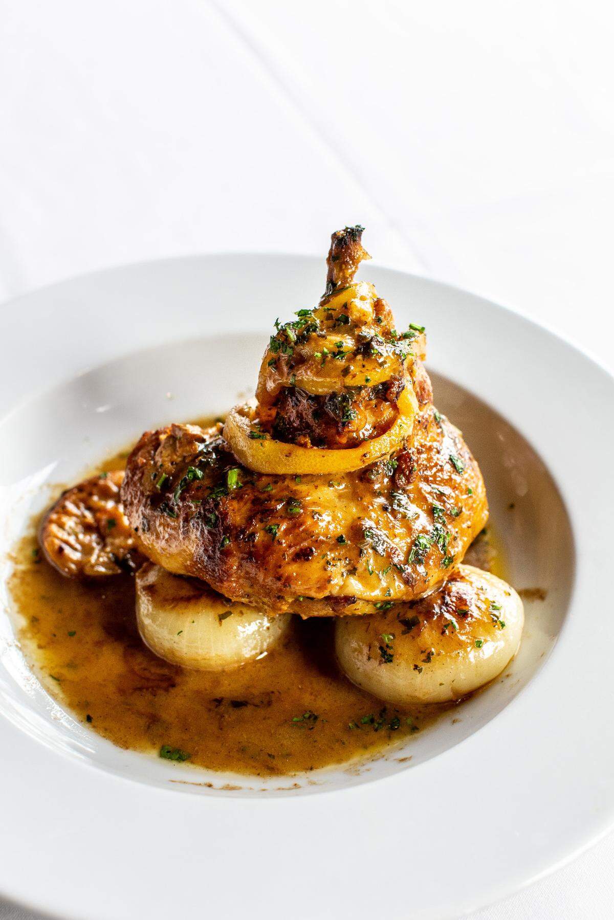 Chicken with grilled lemon and onions at B&B Butchers & Restaurant.