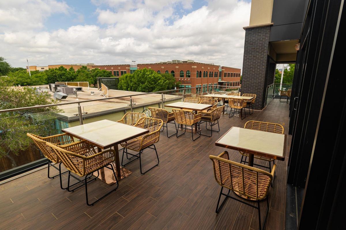 The dining tables on the second floor balcony at the new Ko Thai restaurant on Magnolia Avenue in Fort Worth on Tuesday, April 29, 2025.