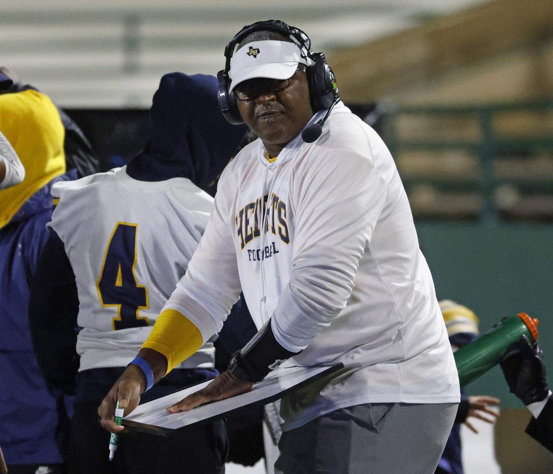 Fort Worth Arlington Heights head coach Curtis James draws up a play during the first half of a UIL Class 5A DI area-round football playoff game Thursday Nov. 20, 2025 at Shotwell Stadium in Abilene, Texas.