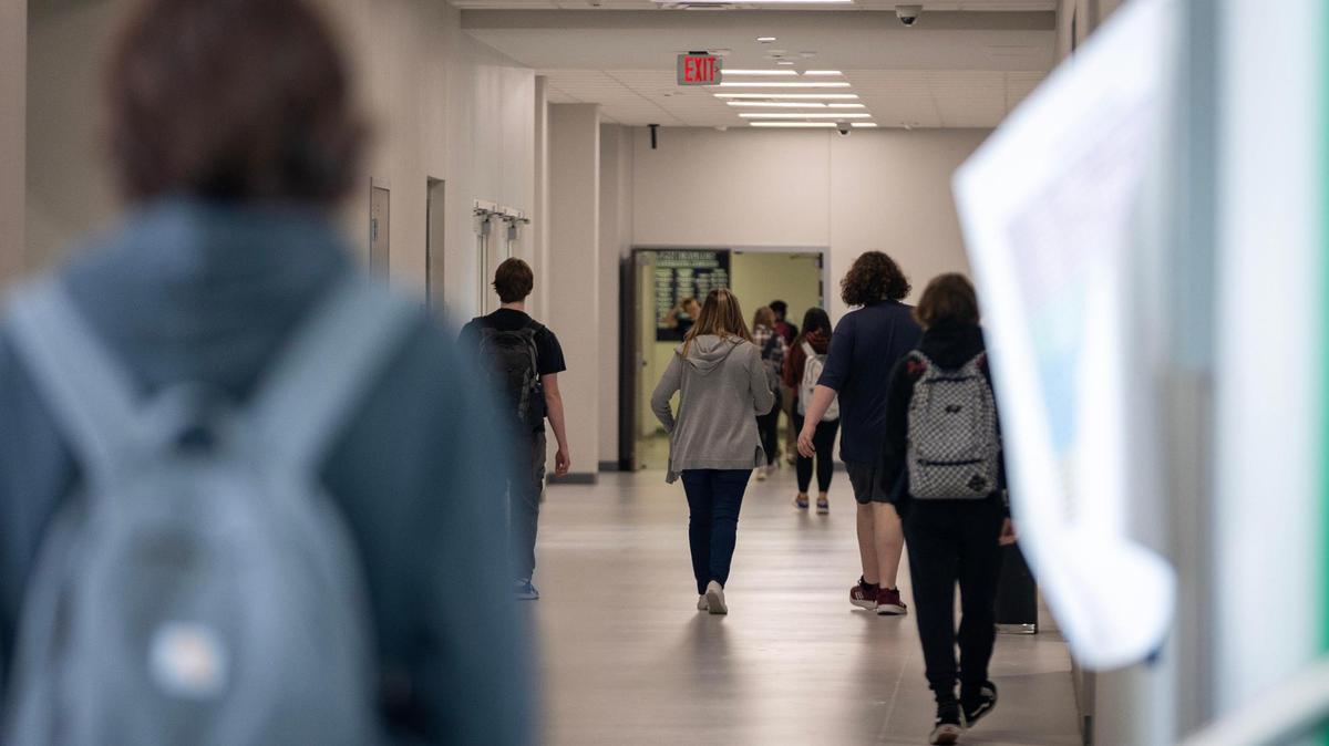 Students walk through a hallway in the freshman building of Eaton High School.