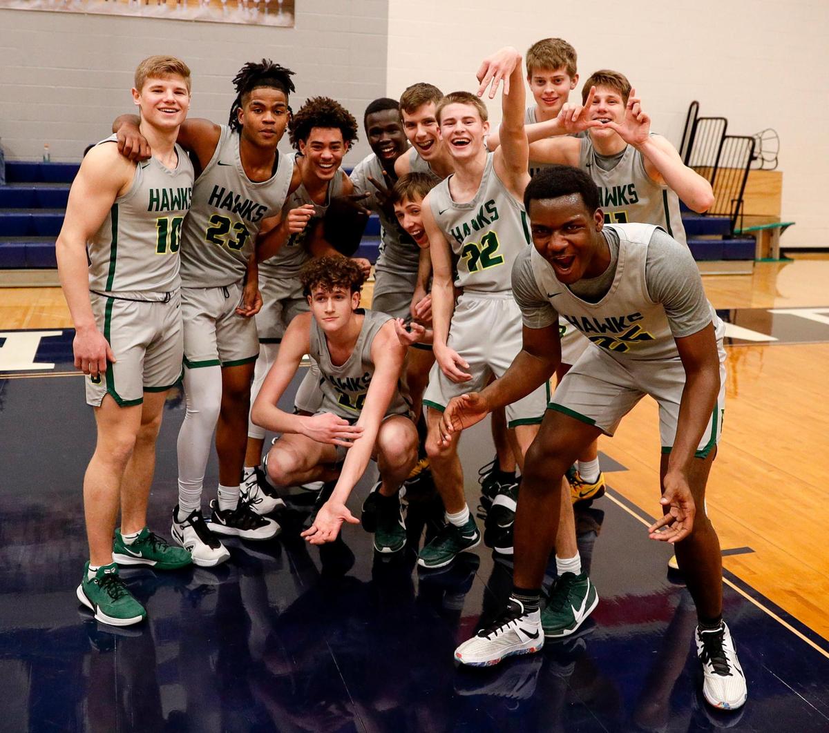 The Birdville Hawks celebrate their victory over Aledo, 53-42 in the 5A Bi-district Boys High School Basketball game played at Richland High School, February 20, 2021 in North Richland Hills, Tx. (Steve Nurenberg Special to the Star-Telegram)