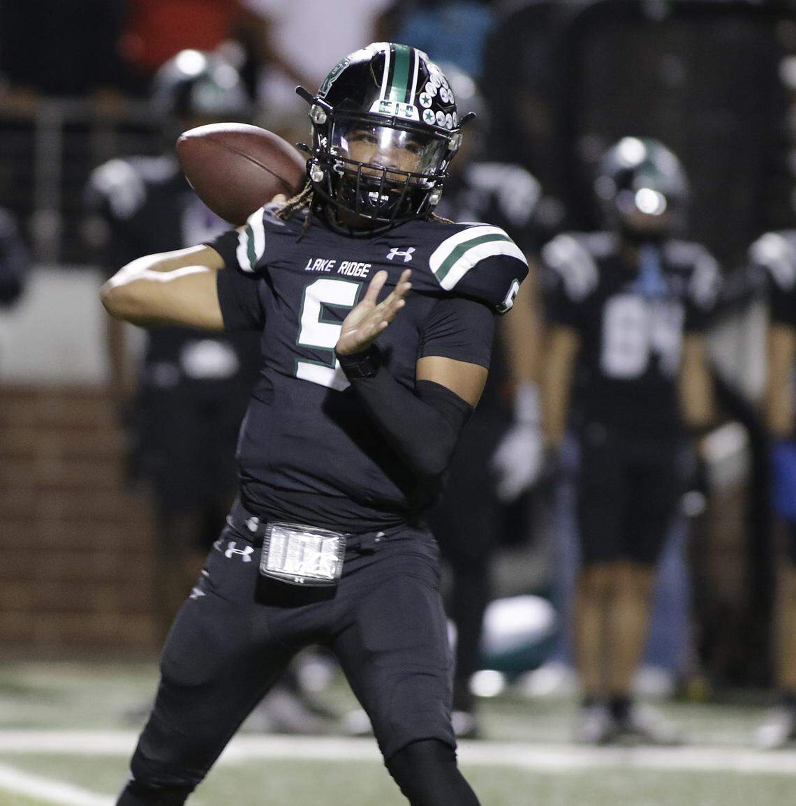 Mansfield Lake Ridge quarterback Deshawn Edwards throws a pass against Euless Trinity during their Class 6A Division I bi-district game on Friday, November 14, 2025 at Newsom Stadium in Mansfield Texas.