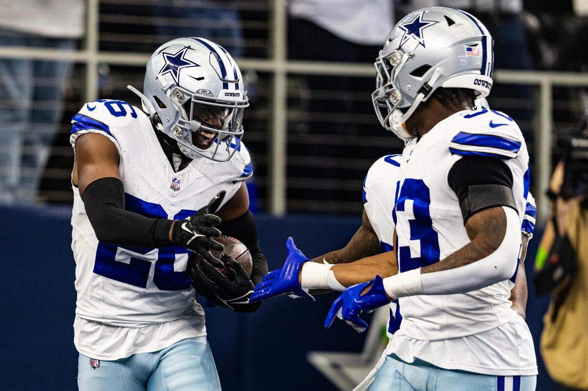 Cowboys cornerback DaRon Bland (26) celebrates after getting a pick six in the first half of an NFL game between the Dallas Cowboys and New England Patriots at AT&T Stadium in Arlington on Sunday, Oct. 1, 2023.