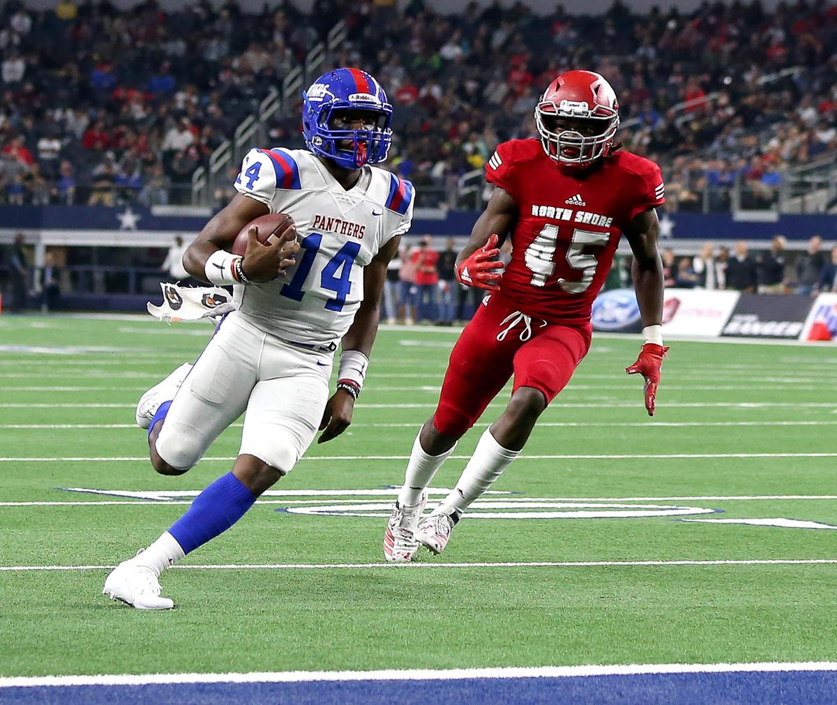 Duncanville quarterback Chris Parson, left, goes in for a touchdown against North Shore during the 6A Division I High School State Football Championship on Saturday.