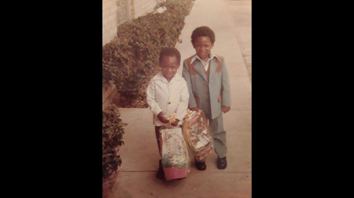 Shannon Brazzell (left) and Dwayne Brazzell Jr. (right) smile for a photo as kids. They grew up playing football out in their street, using driveways and cars as endzones, Shannon said.